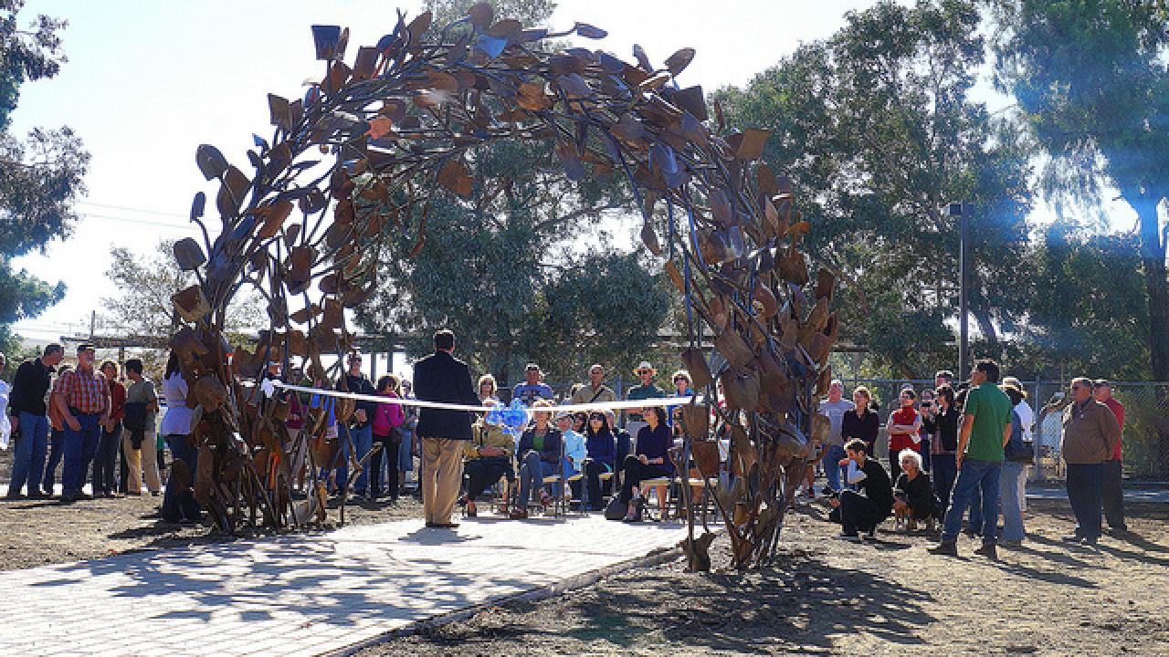 City of Davis Mayor Joe Kravoza addresses the gathering at the “Shovel Gateway” sculpture dedication. ribbon cutting of the shovel sculpture