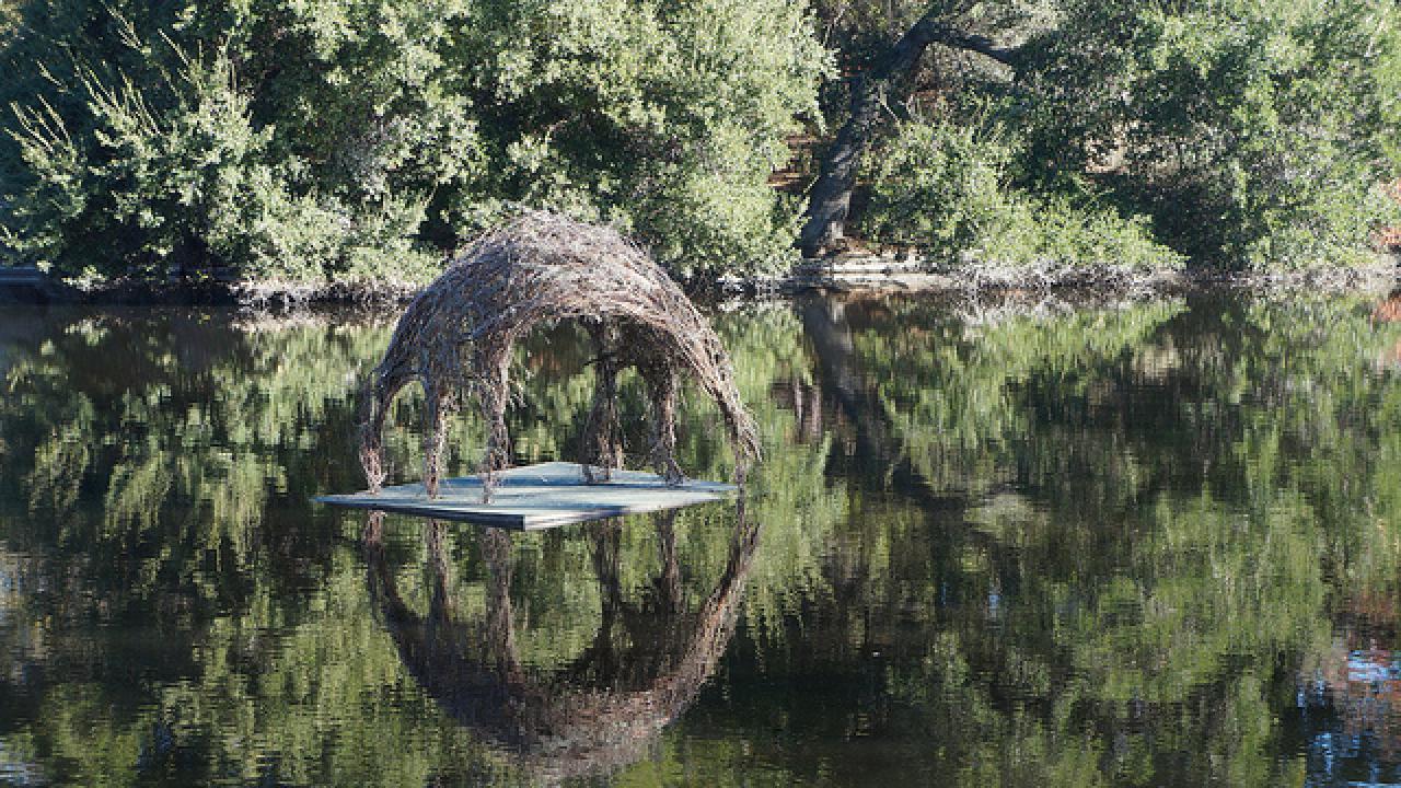 Spafford House, a public art installaton by student’s from Robin Hill’s Art 152E class. This and three other student art installations will be on display through December 21, 2013. small house floating on lake