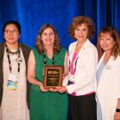 Tracy Qiu, Carmia Feldman, Kathleen Socolofsky, and Michelle Provasnik pose with APGA award plaque