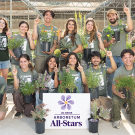 A group of Learning by Leading™ student interns and employees cheering with a sign in the front that has the UC Davis Arboretum All-Stars logo. Large images of a few of the All-Star plant flowers decorate the edges.